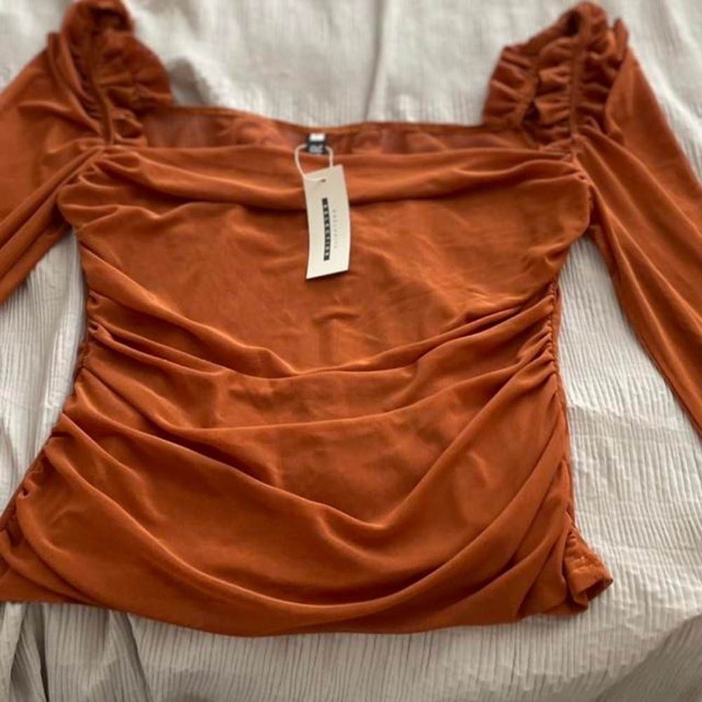Sheer top. Never worn.